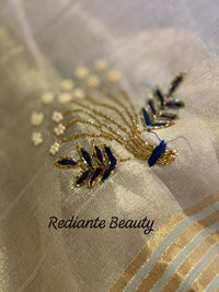 Powder Blue Tissue Organza Saree – Golden Opulence Cascade