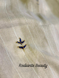 Powder Blue Tissue Organza Saree – Golden Opulence Cascade