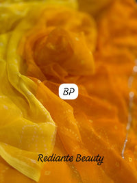 Golden Saffron Bandhani Georgette Saree – Silver Cut Dana & Beaded Leaf Detailing