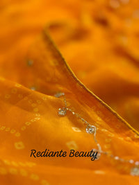 Golden Saffron Bandhani Georgette Saree – Silver Cut Dana & Beaded Leaf Detailing