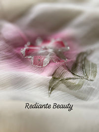 Off-White Chiffon Saree – Blush Bloom Elegance with Swarovski Detailing