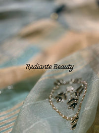 Sea Green Tissue Organza Saree – Golden Grace with Forest Green Detailing