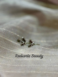 Light Pink Tissue Organza Saree – Purple Elegance with Golden Zari Glamour